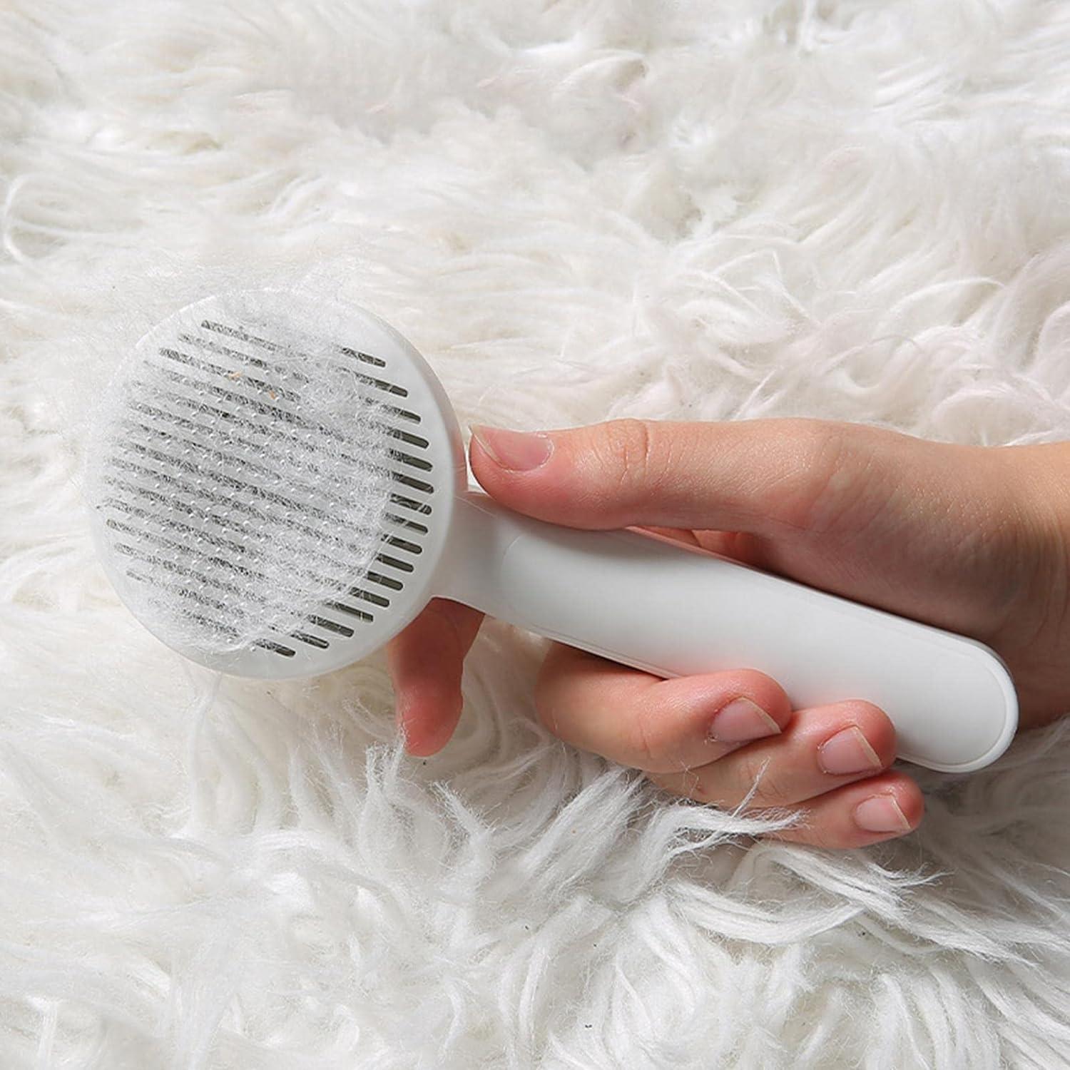 rfyrru-0i hair removal massager for pets with white handle removing fur from a soft white surface