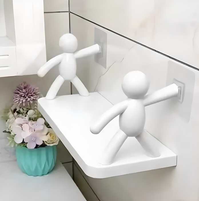 White minimalist wall hanging bathroom shelf with two human figurine brackets holding small toiletries