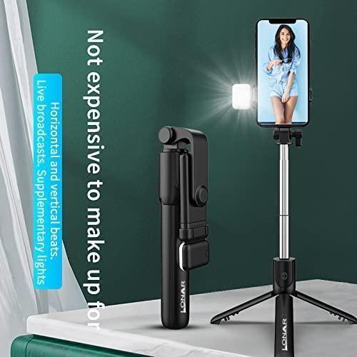 Extendable selfie stick tripod with tripod legs and phone holder showing a woman on phone screen