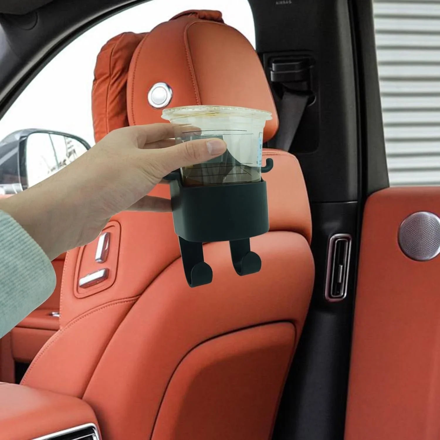 Multifunctional hanging storage cup attached to car seat holding a drink cup for organized car interior