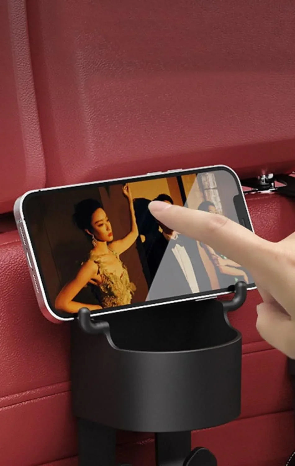Black multifunctional hanging storage cup holding a smartphone attached to car seat back