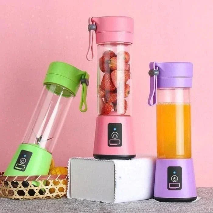 Colorful portable blender with power bank in green pink and purple with fruits and juice inside