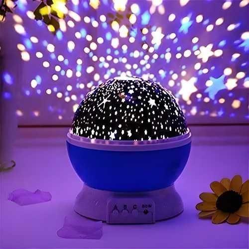 Blue star projector night light for kids casting star and flower patterns on walls and ceiling