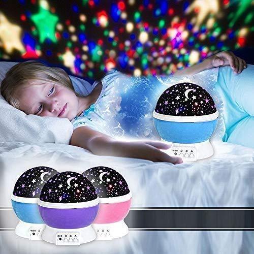 Star projector night light for kids with colorful star and moon patterns projecting on bedroom ceiling